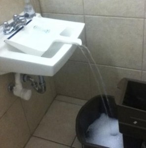 Use a dustpan to fill a large bucket. Image courtesy of lifehacker.com 